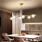 Gold Linear Island Light with 6 Lights Transparent Glass Globe Shades