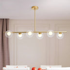 Gold Linear Island Light with 6 Lights Transparent Glass Globe Shades