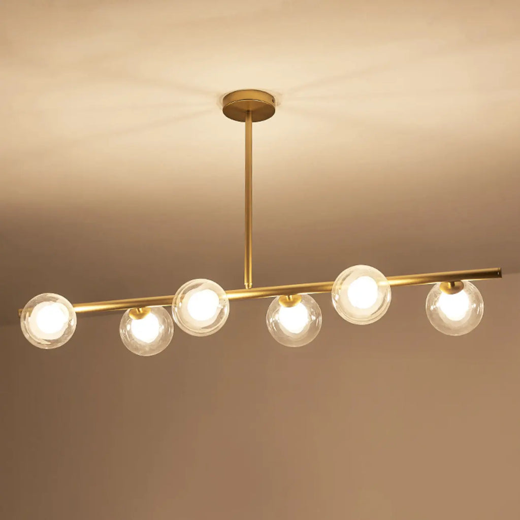 Gold Linear Island Light with 6 Lights Transparent Glass Globe Shades